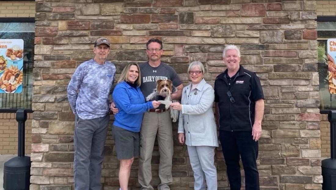 Group of pet advocates posed with a dog in front of Mattoon Grill & Chill|Group of people posed with dogs wearing a tuxedo bandana and wedding dress|Two women posed with a cat|Group of pet advocates posed with a dog in front of Mattoon Grill & Chill|Mattoon Mayor with a local business owner and his dog inside the business