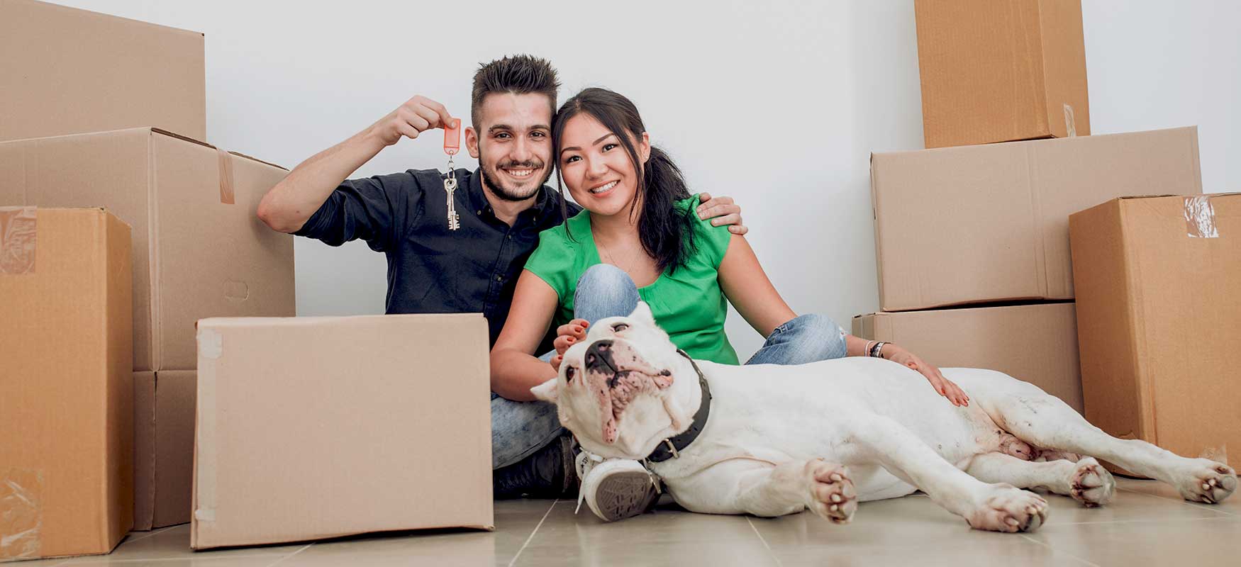 couple with dog in new apartment