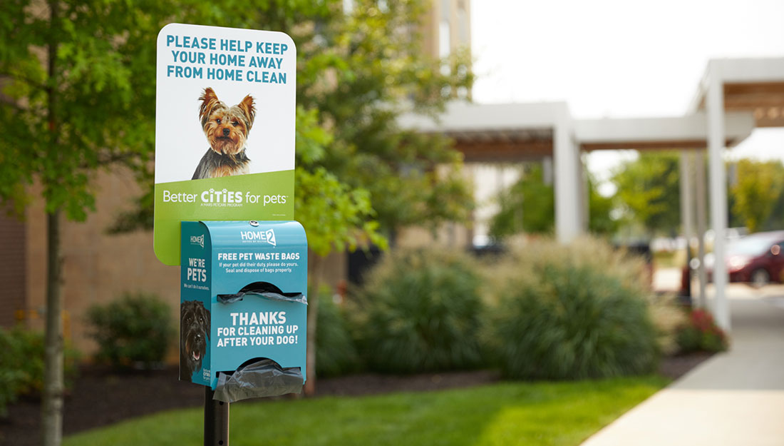 pet waste bag dispenser outside a hotel